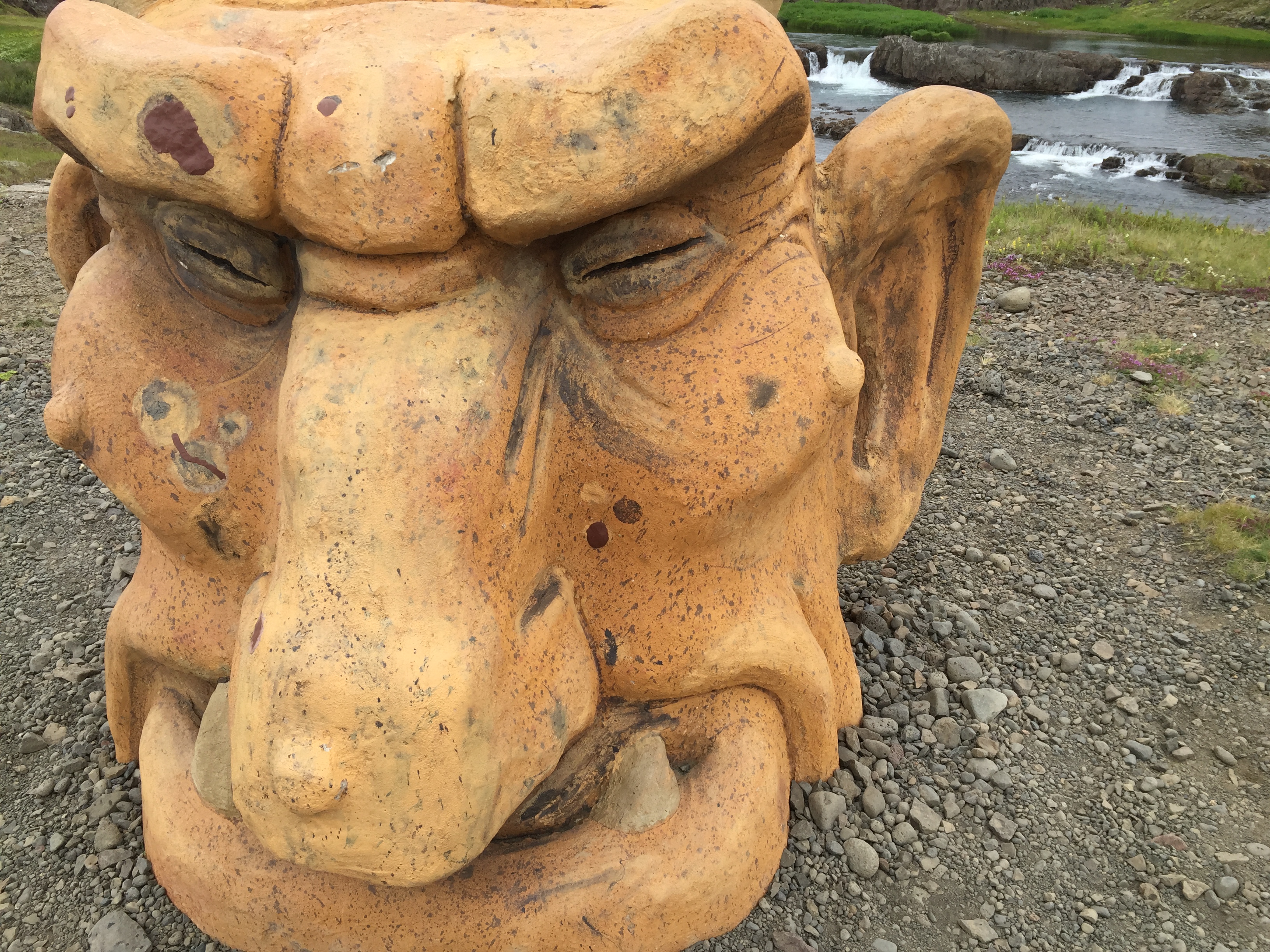 Iceland troll head by falls